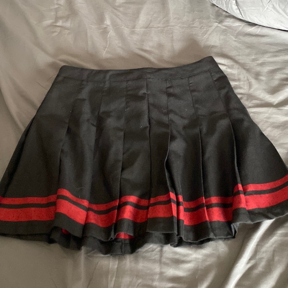 Great quality never been worn black and red And the brand is Rue 21